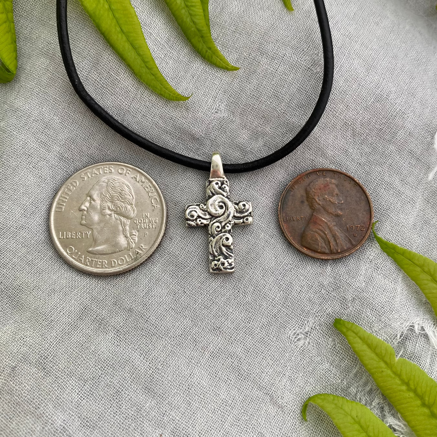 chunky small sterling silver cross on black leather cord with unique swirling wave design, gift for men and women, handcarved and produced in USA