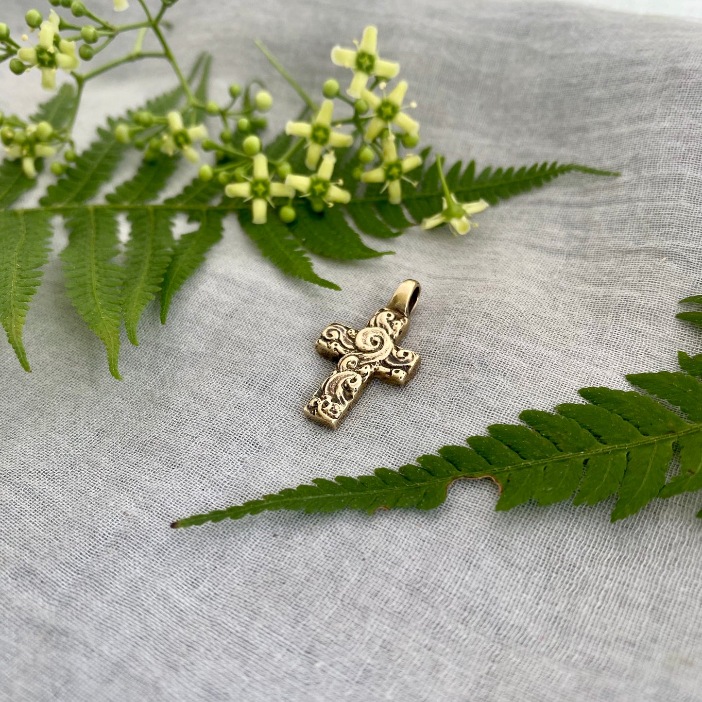 chunky small brass cross pendant; unusual swirling waves, water of life; for men, women; hand carved original design; necklace component
