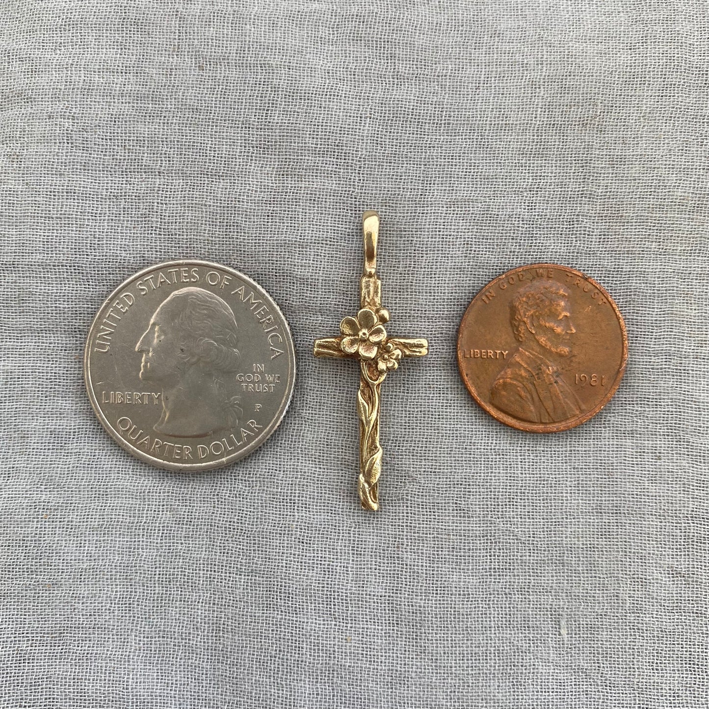 Dainty floral cross pendant for a necklace; gold toned brass; forget-me-not blossoms, leaves, wood grain texture; feminine flower; no chain