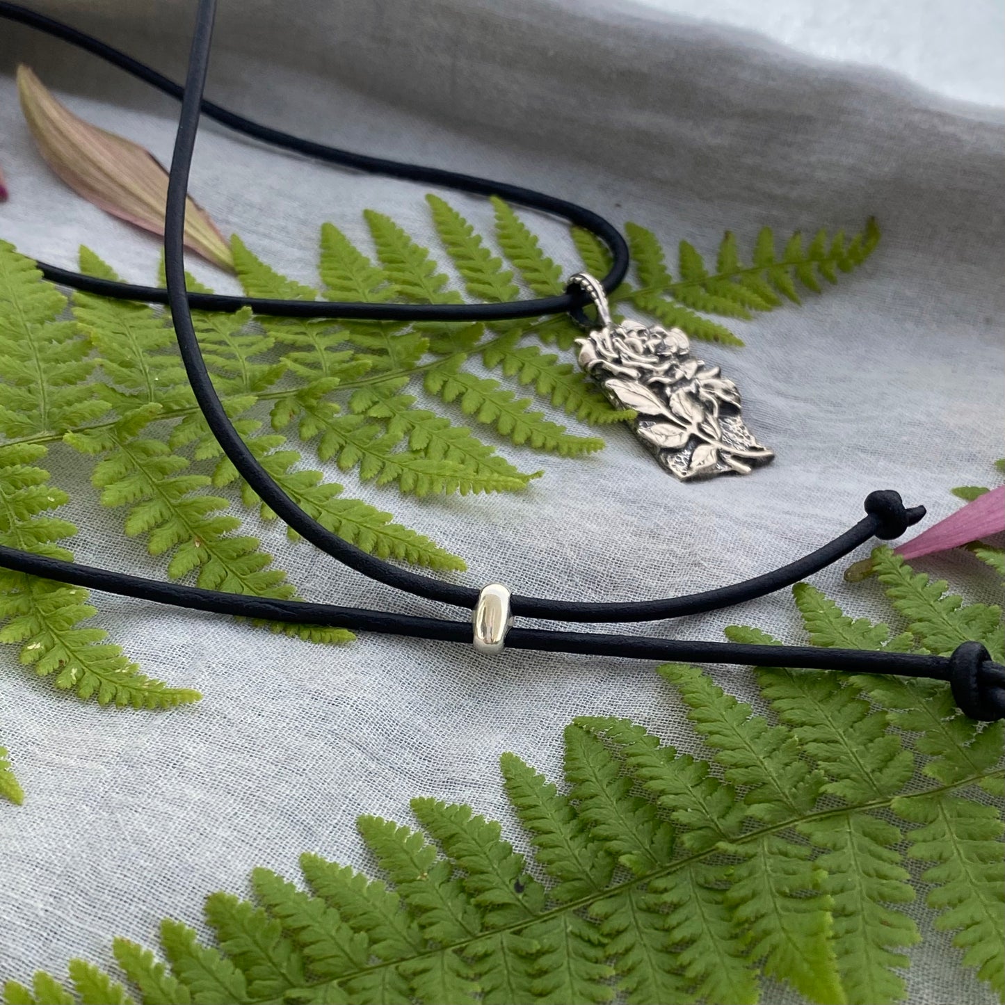 Romantic Victorian style sterling silver rose pendant, black leather cord necklace, hand carved original design with rose, bud, and leaves