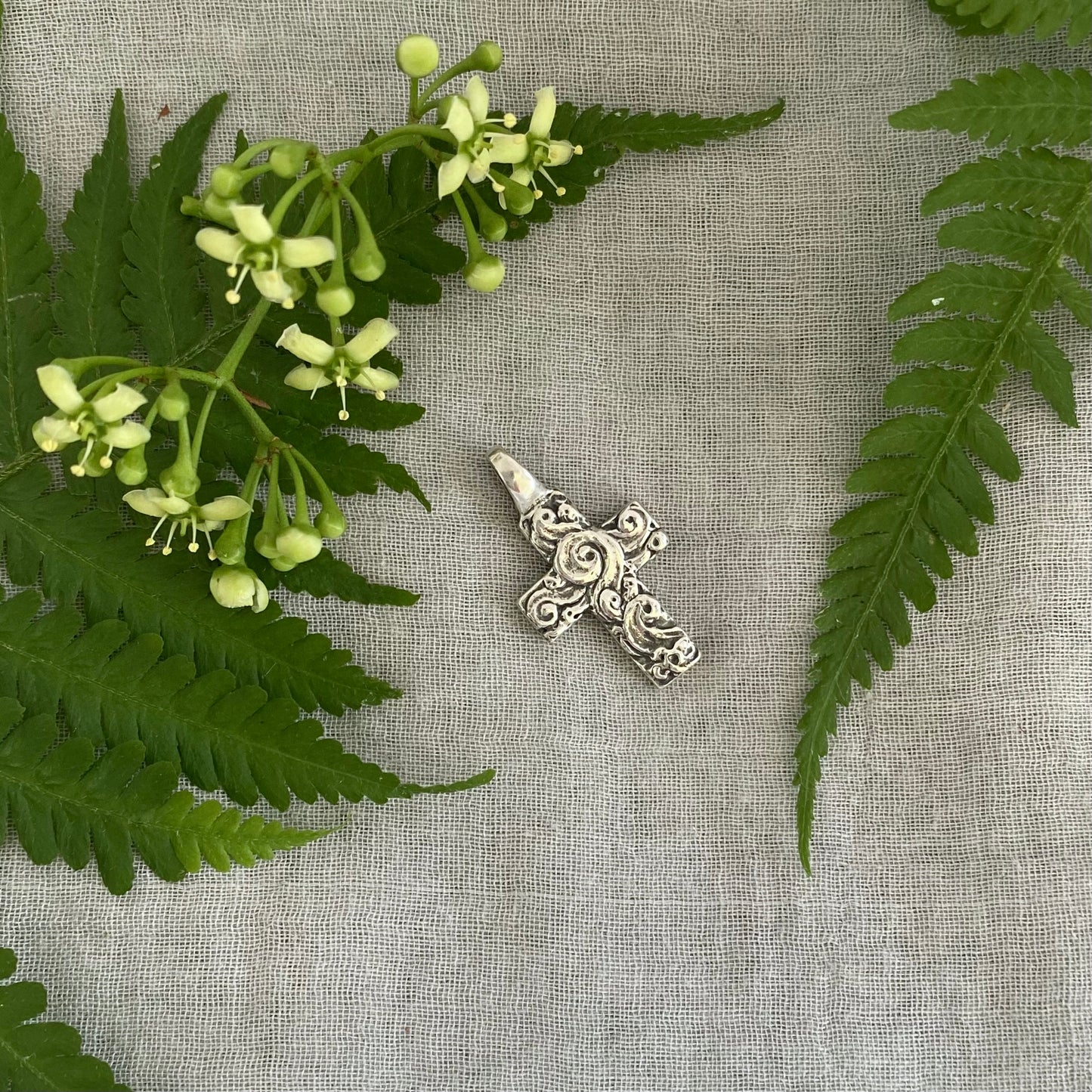 chunky small sterling silver cross pendant; unusual swirling wave design; for men, women; hand carved, artist designed necklace component