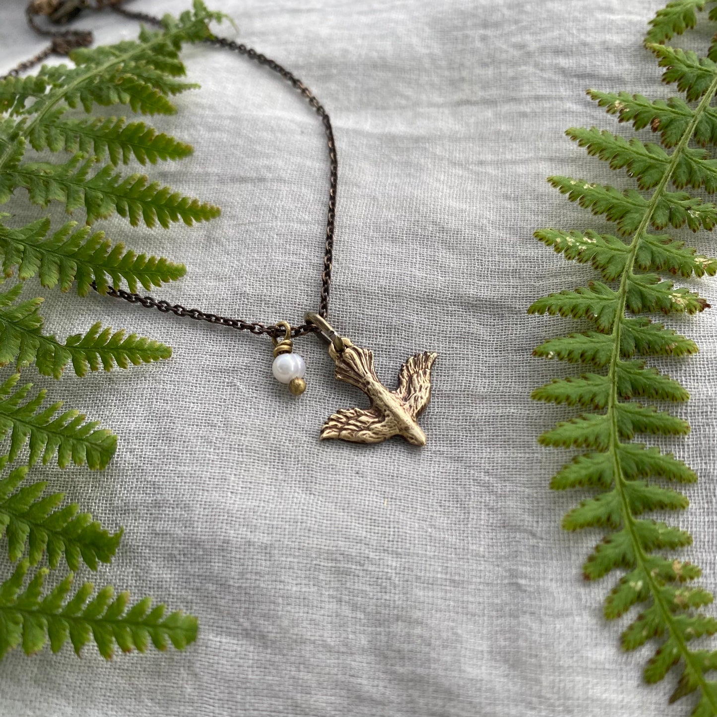Tiny dainty dove necklace with freshwater pearl; antiqued brass pendant and chain