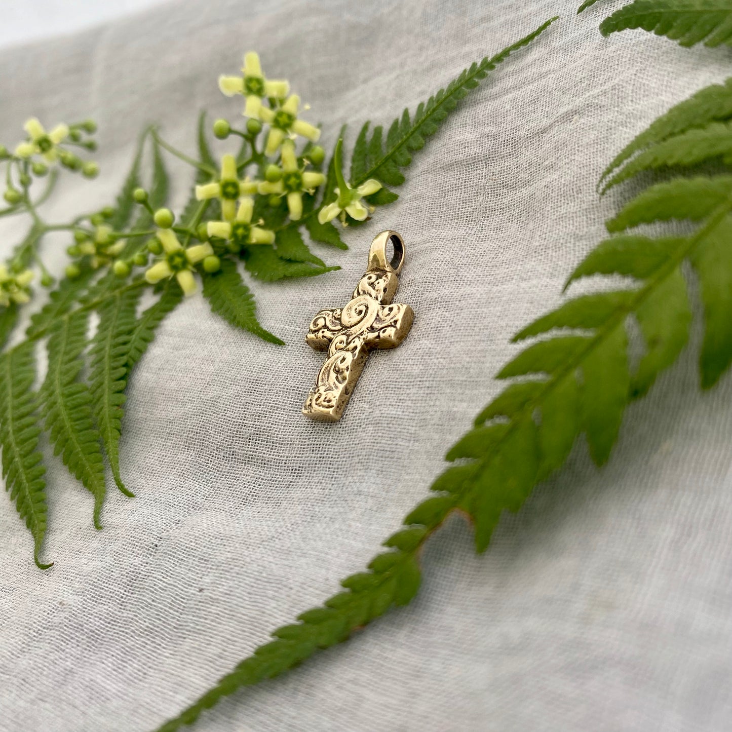 chunky small brass cross pendant; unusual swirling waves, water of life; for men, women; hand carved original design; necklace component