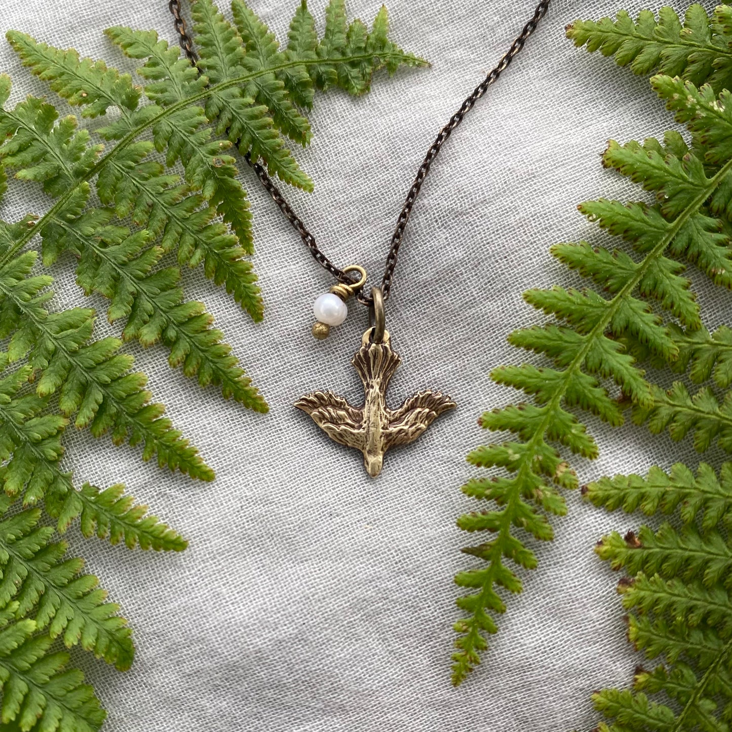 Tiny dainty dove necklace with freshwater pearl; antiqued brass pendant and chain