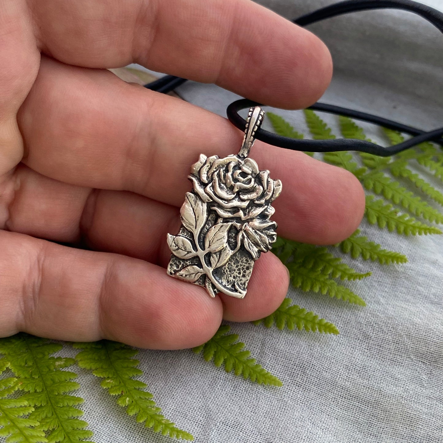 Romantic Victorian style sterling silver rose pendant, black leather cord necklace, hand carved original design with rose, bud, and leaves