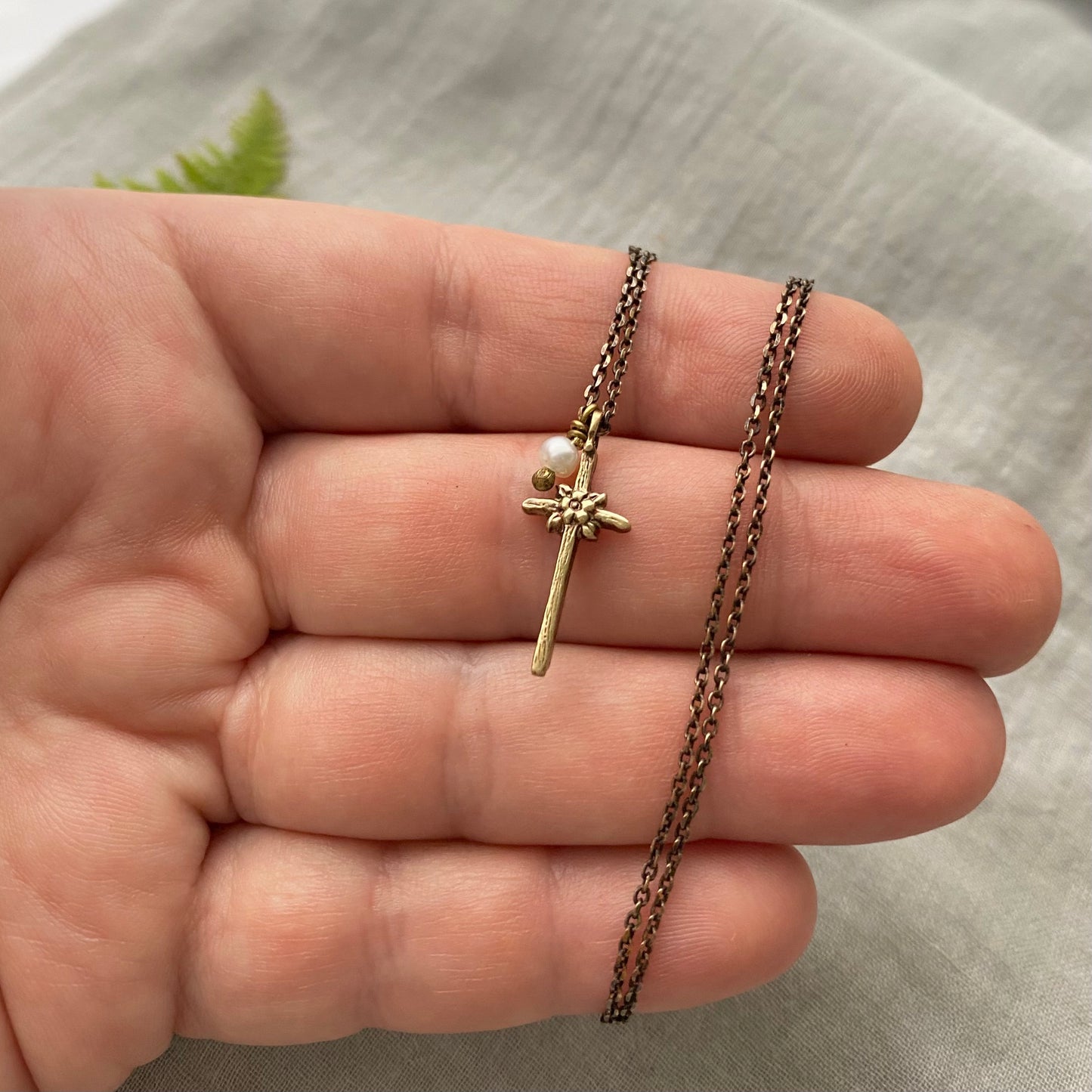 Tiny dainty cross necklace with freshwater pearl; antiqued brass pendant and chain