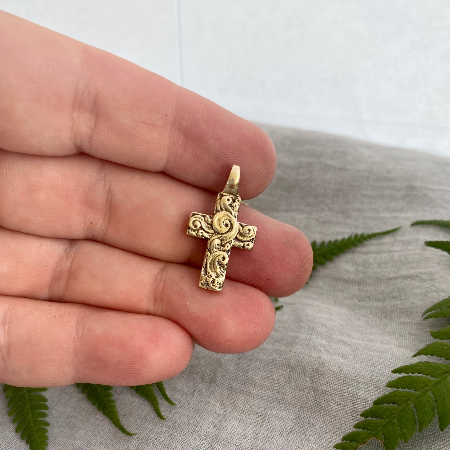 chunky small brass cross pendant; unusual swirling waves, water of life; for men, women; hand carved original design; necklace component