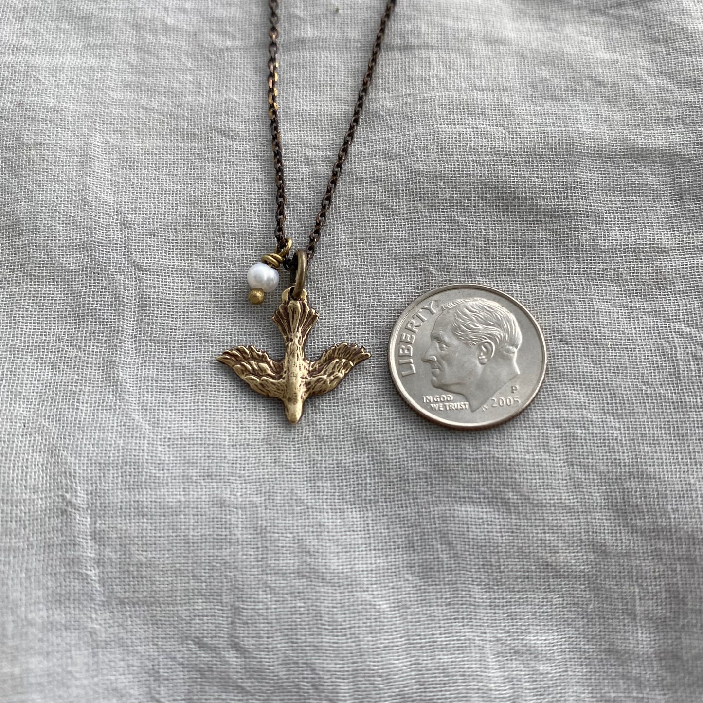 Tiny dainty dove necklace with freshwater pearl; antiqued brass pendant and chain