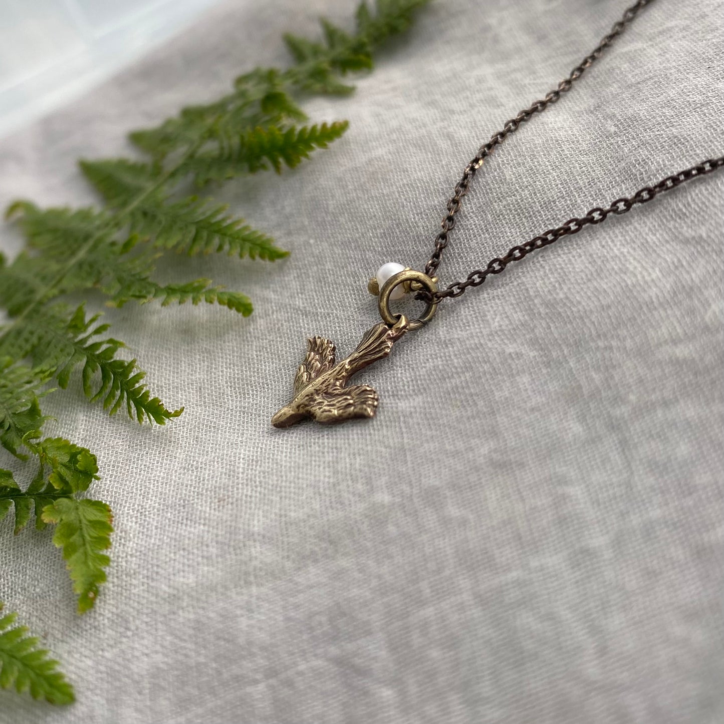 Tiny dainty dove necklace with freshwater pearl; antiqued brass pendant and chain