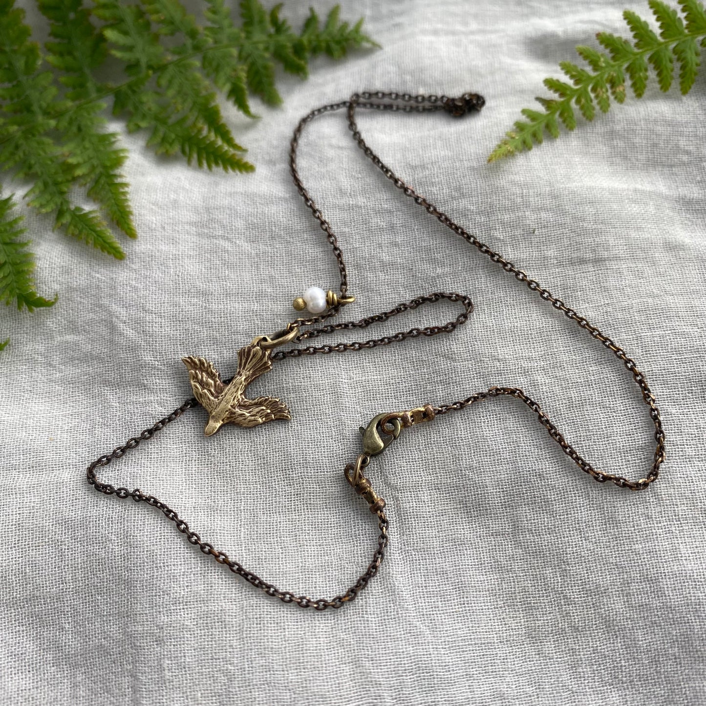 Tiny dainty dove necklace with freshwater pearl; antiqued brass pendant and chain