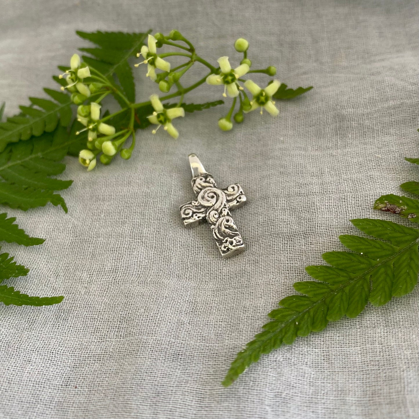 chunky small sterling silver cross pendant; unusual swirling wave design; for men, women; hand carved, artist designed necklace component