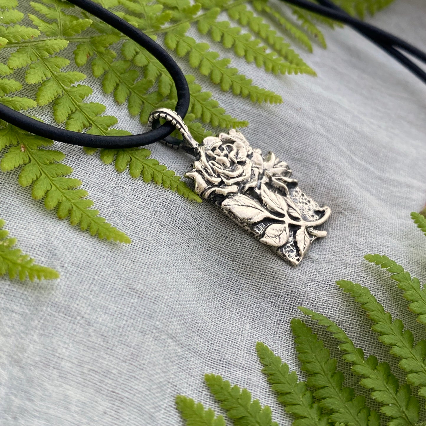 Romantic Victorian style sterling silver rose pendant, black leather cord necklace, hand carved original design with rose, bud, and leaves
