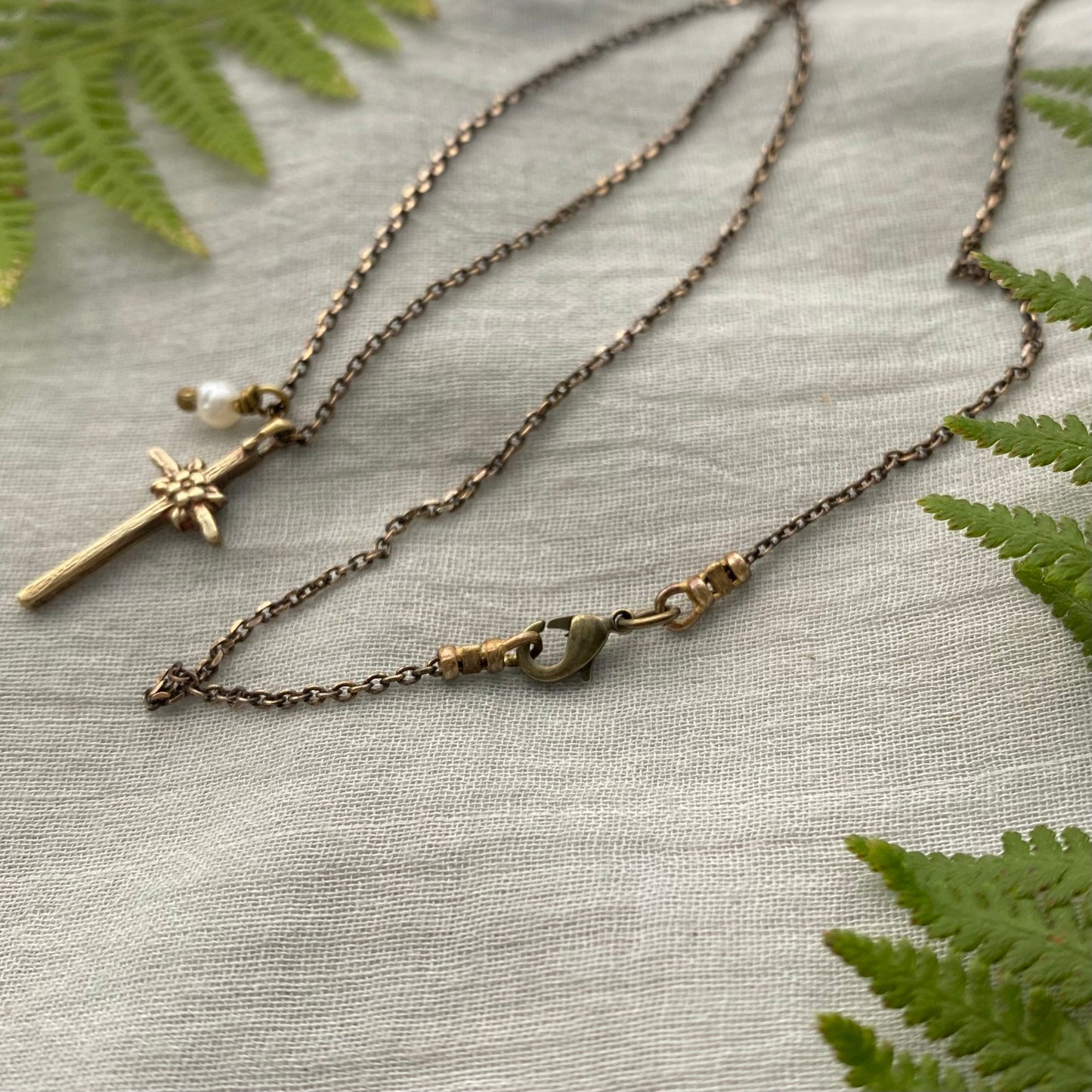 Tiny dainty cross necklace with freshwater pearl; antiqued brass pendant and chain