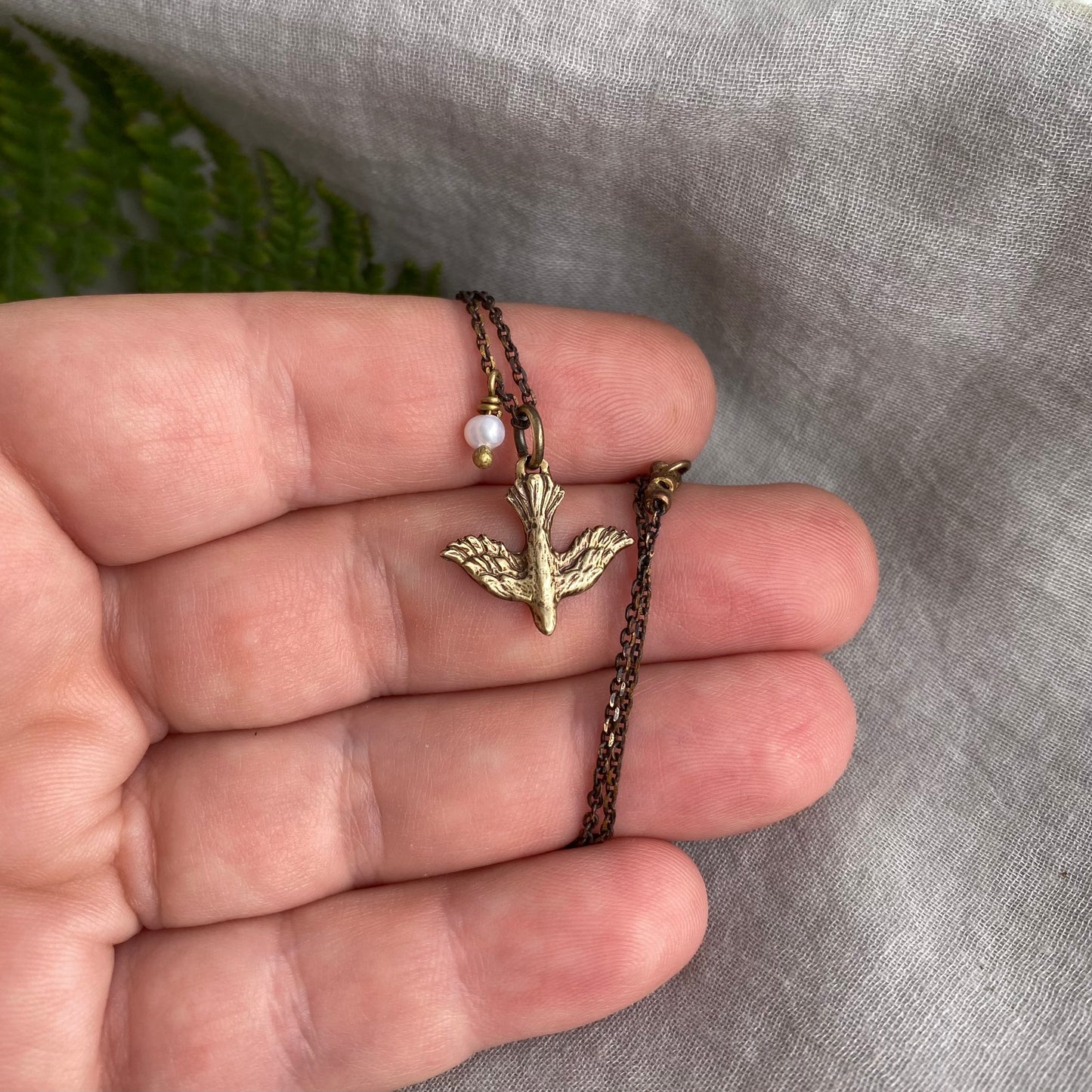 Tiny dainty dove necklace with freshwater pearl; antiqued brass pendant and chain