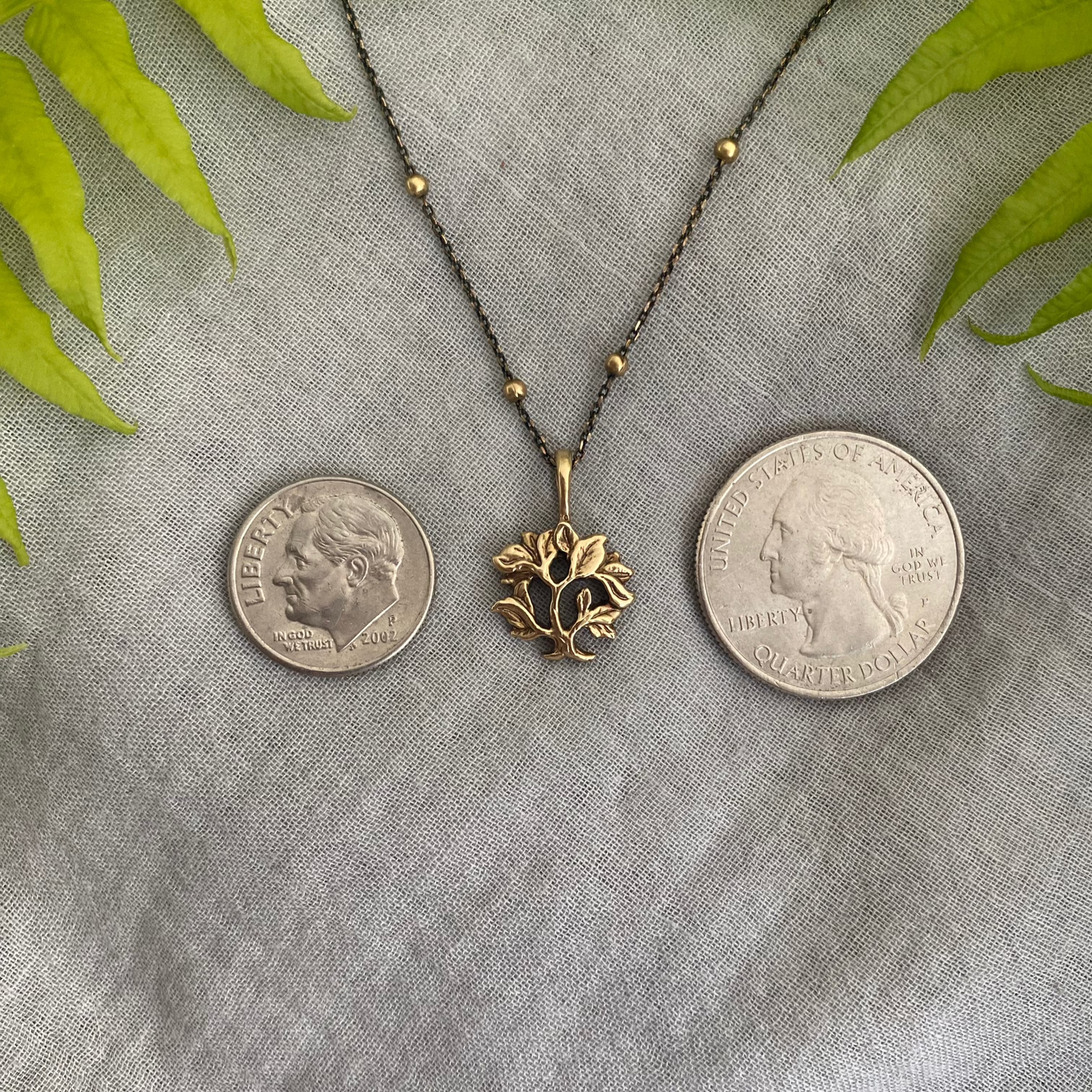 dainty gold-toned tree of life necklace; tiny antiqued brass pendant and chain; gift for nature lover; mythological and Christian symbol