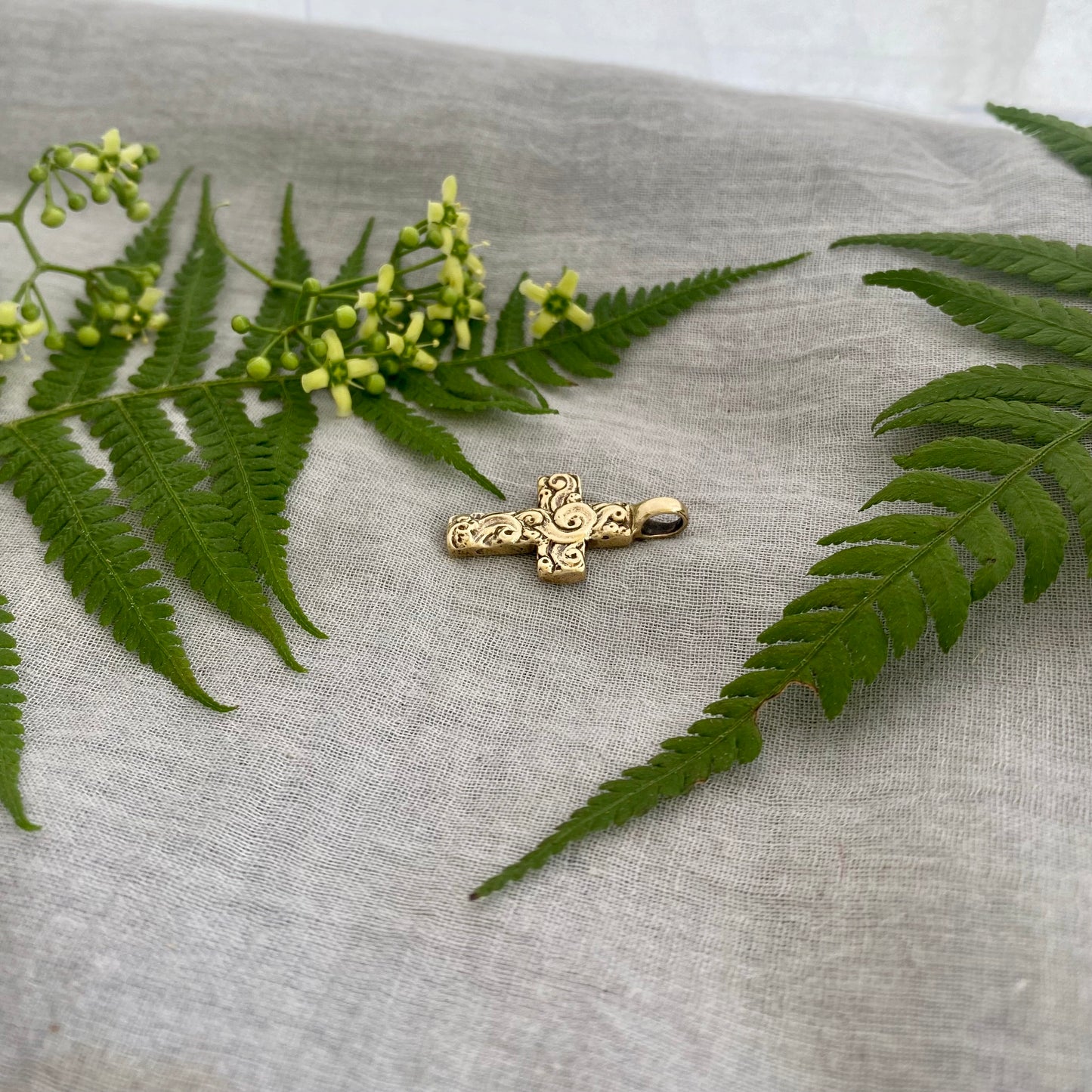 chunky small brass cross pendant; unusual swirling waves, water of life; for men, women; hand carved original design; necklace component