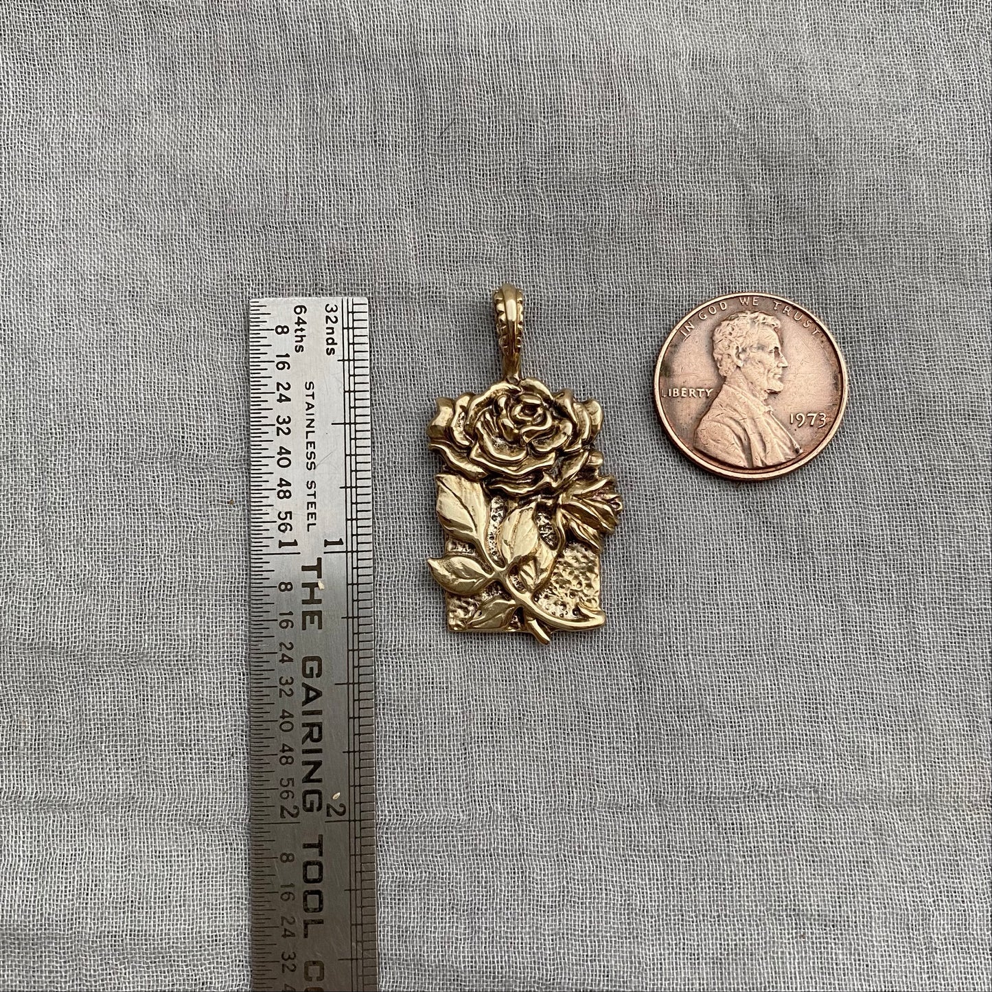 Sculptural brass rose pendant with rosebud and leaves