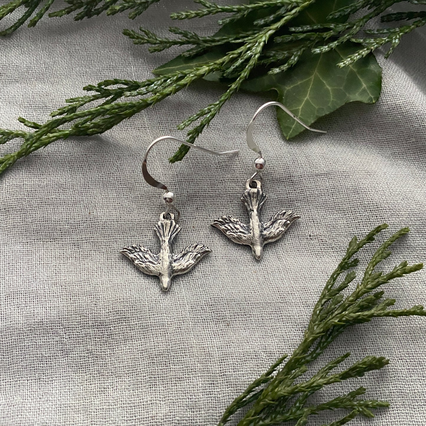 Dainty, dangling, descending dove earrings; solid sterling silver