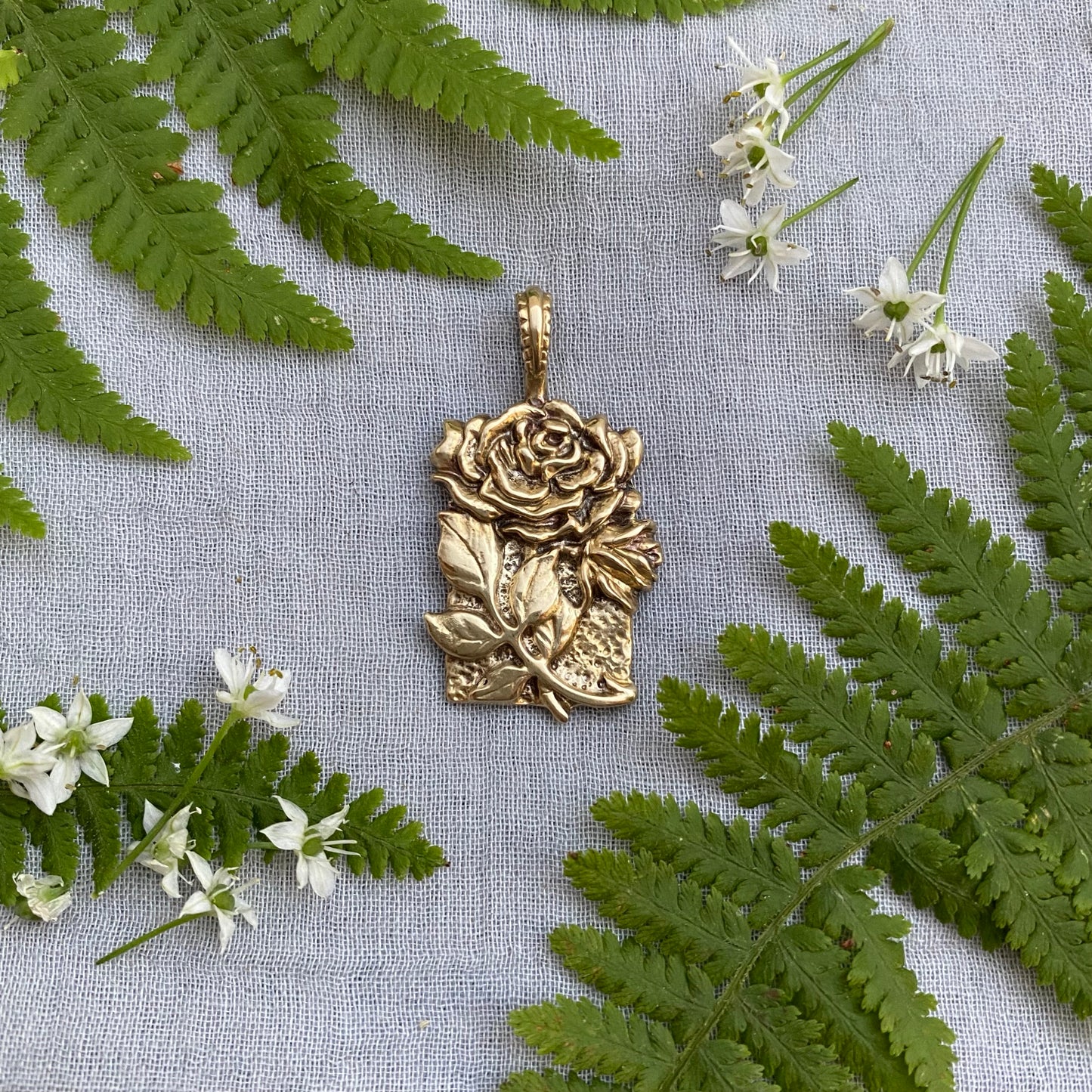 Sculptural brass rose pendant with rosebud and leaves