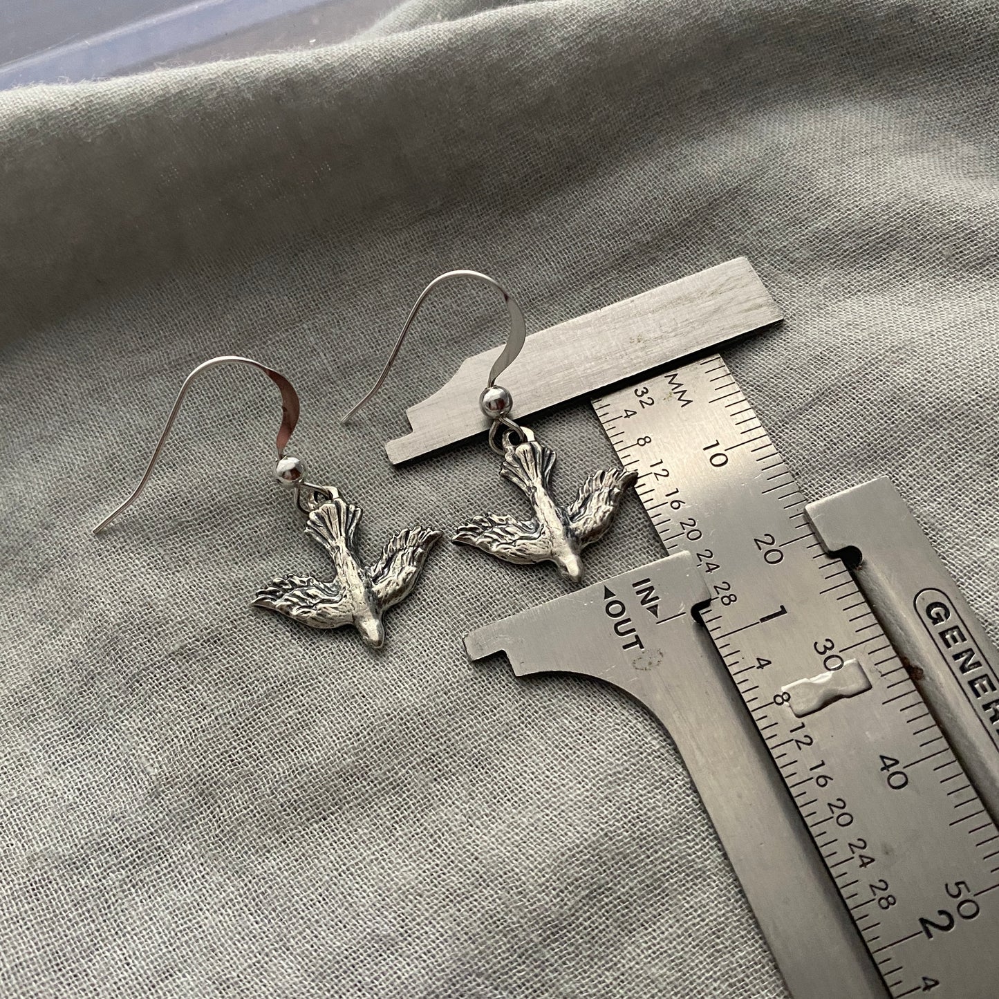 Dainty, dangling, descending dove earrings; solid sterling silver