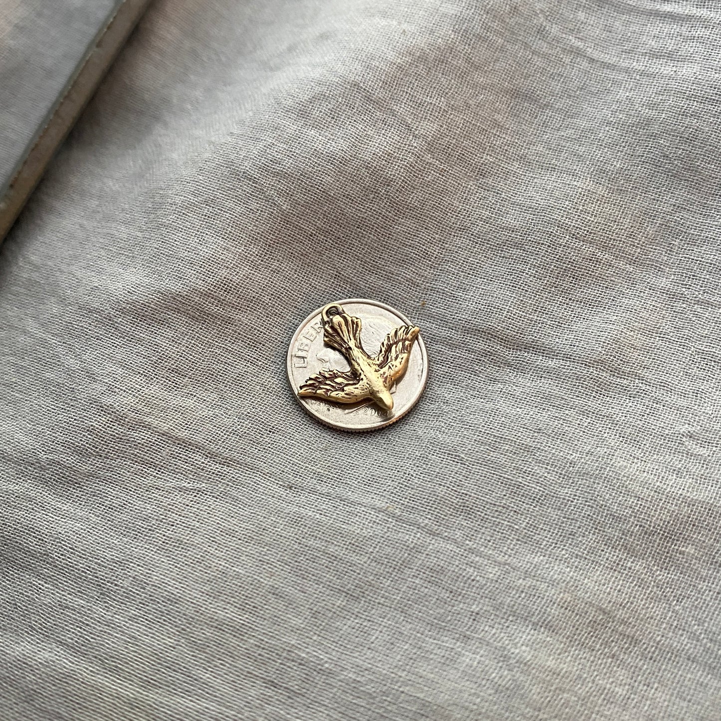 Tiny, Antiqued Brass, Descending Dove Charm; Unique, Hand Carved Design