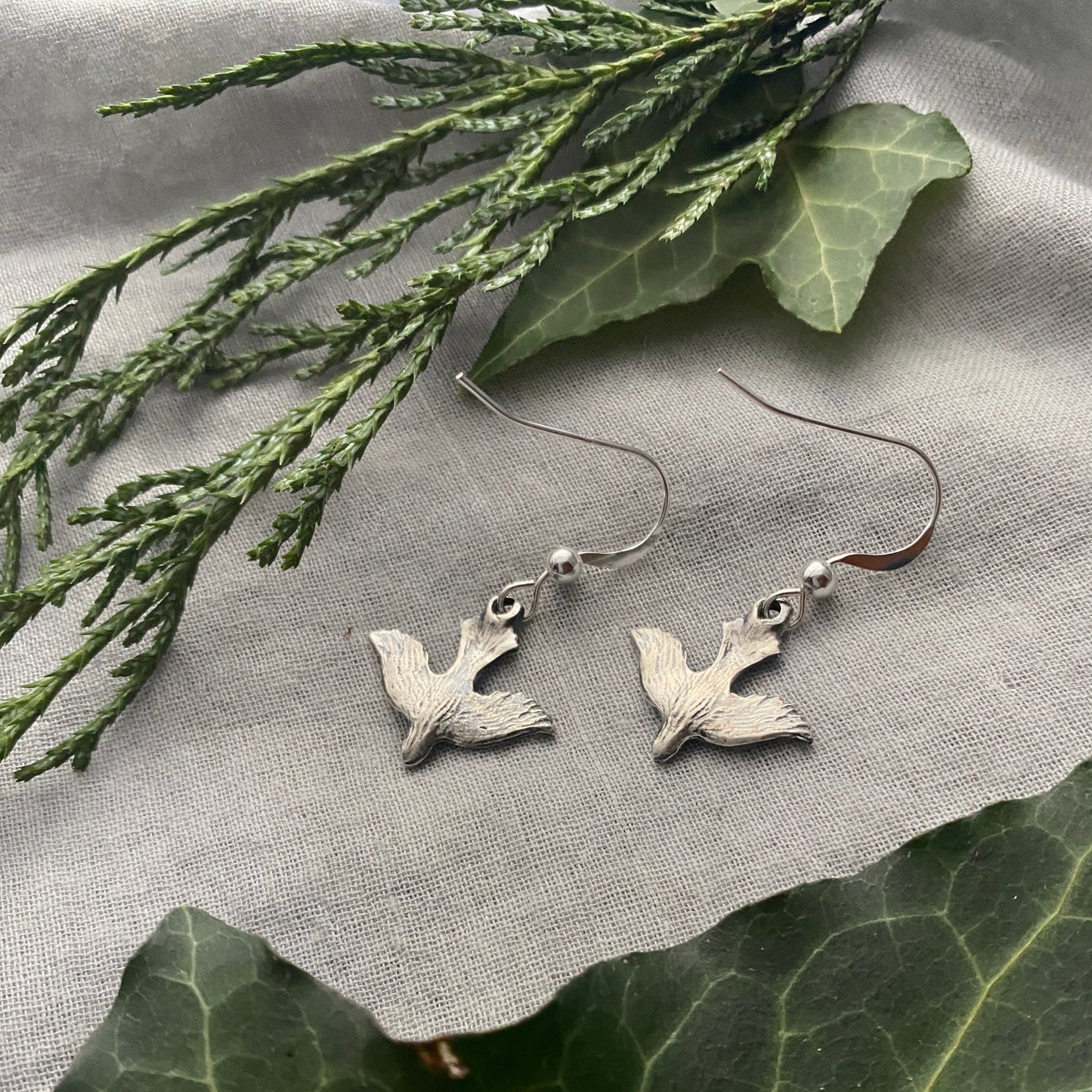 Dainty, dangling, descending dove earrings; solid sterling silver