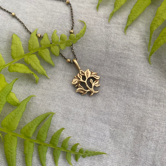 dainty gold-toned tree of life necklace; tiny antiqued brass pendant and chain; gift for nature lover; mythological and Christian symbol