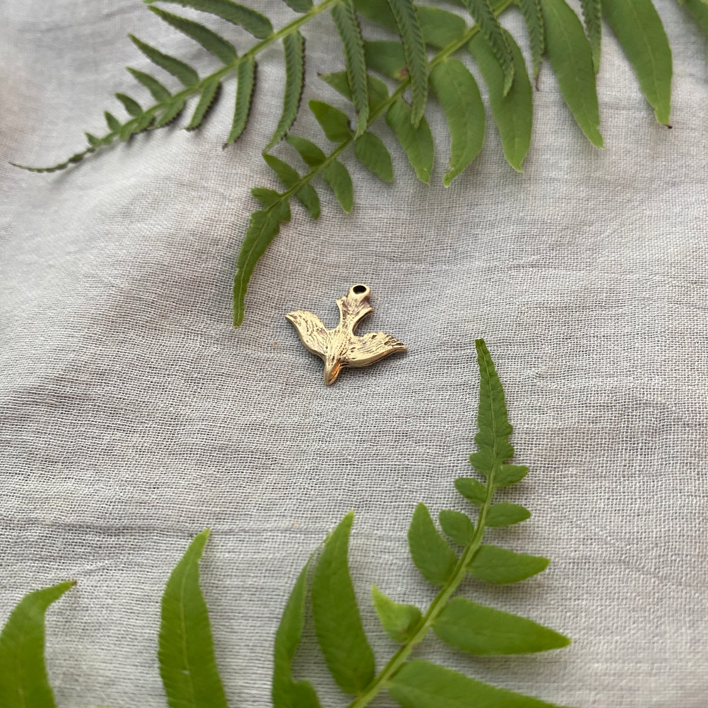 Tiny, Antiqued Brass, Descending Dove Charm; Unique, Hand Carved Design