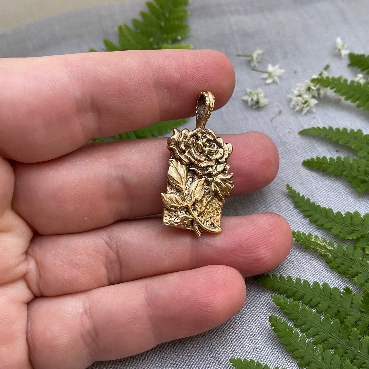 Sculptural brass rose pendant with rosebud and leaves