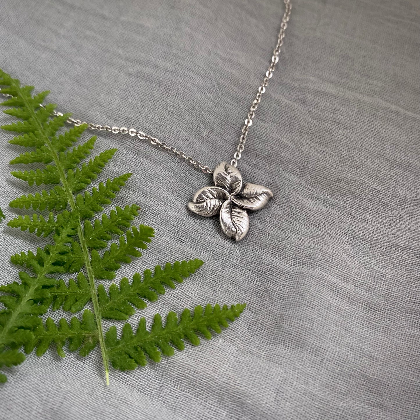 small sterling silver leaf cross pendant