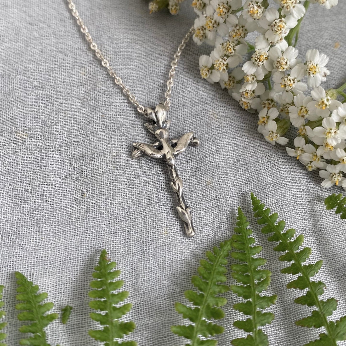 Small sterling silver cross necklace with dove