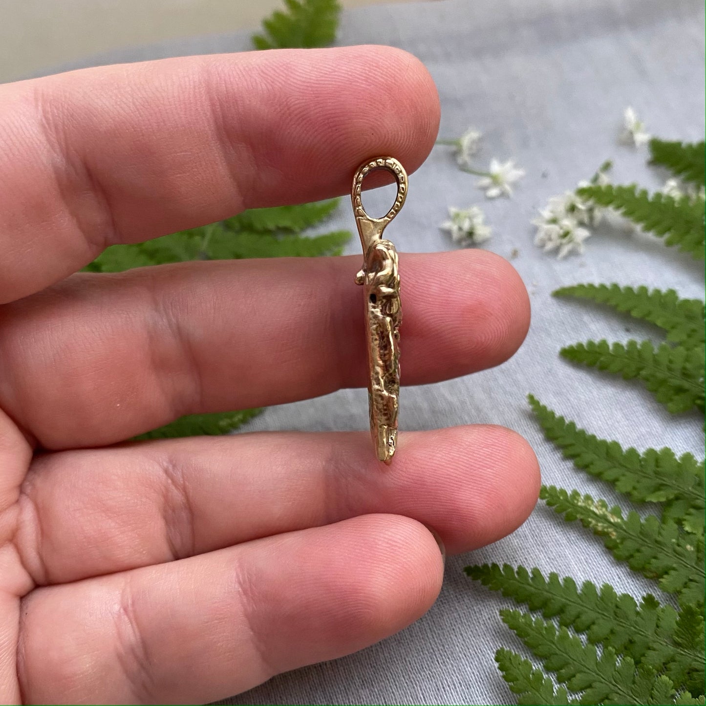 Sculptural brass rose pendant with rosebud and leaves